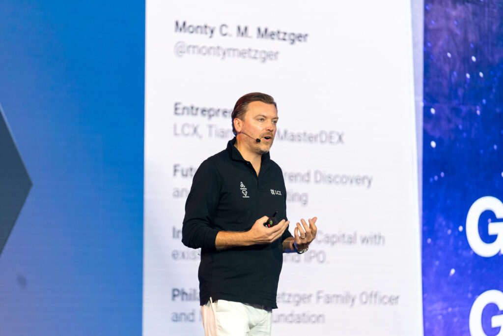 Keynote speaker presenting on stage at a corporate MICE conference