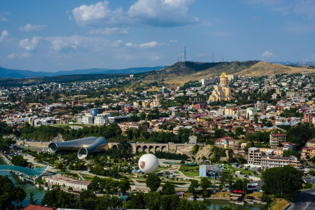 Panoramic view of Tbilisi with the Holy Trinity Cathedral and Bridge of Peace seen from Narikala fortress