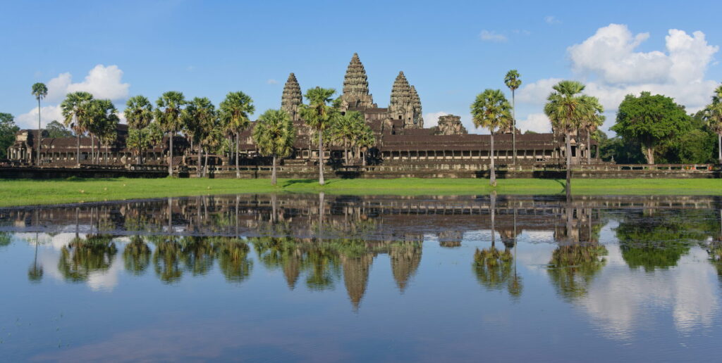 Angkor Wat temple reflected in its moat at dawn, the best time to visit Cambodia