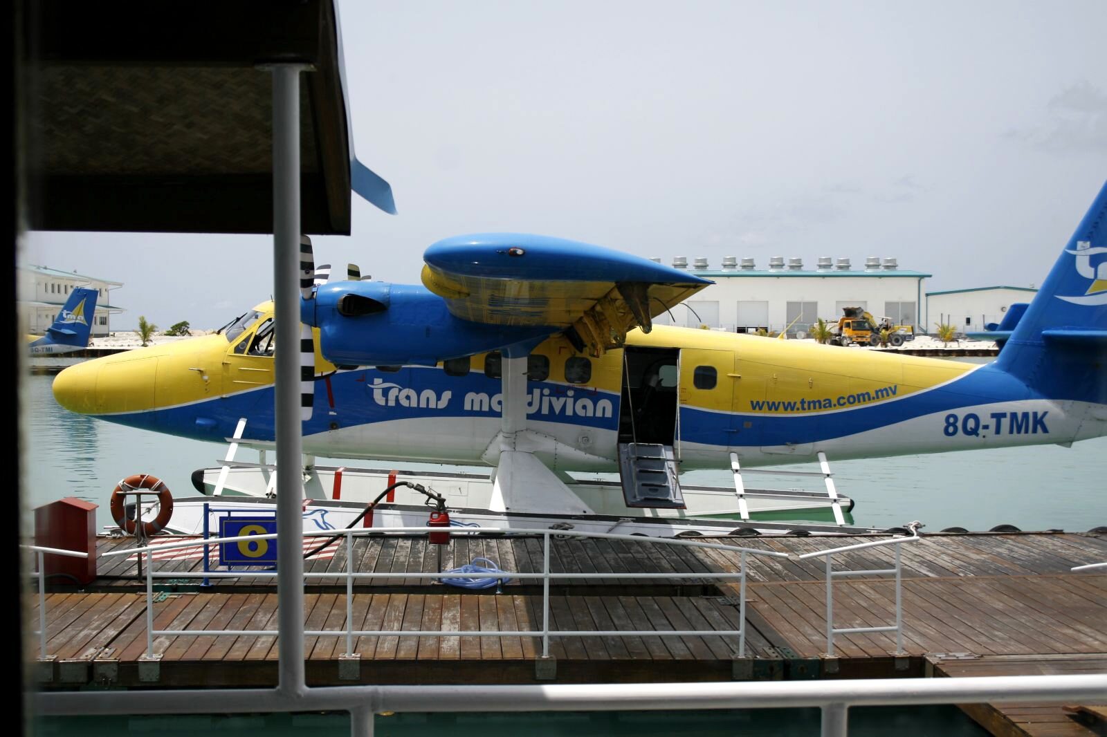 A Trans Maldivian Airways Twin Otter seaplane on floats at the Velana International Airport seaplane terminal