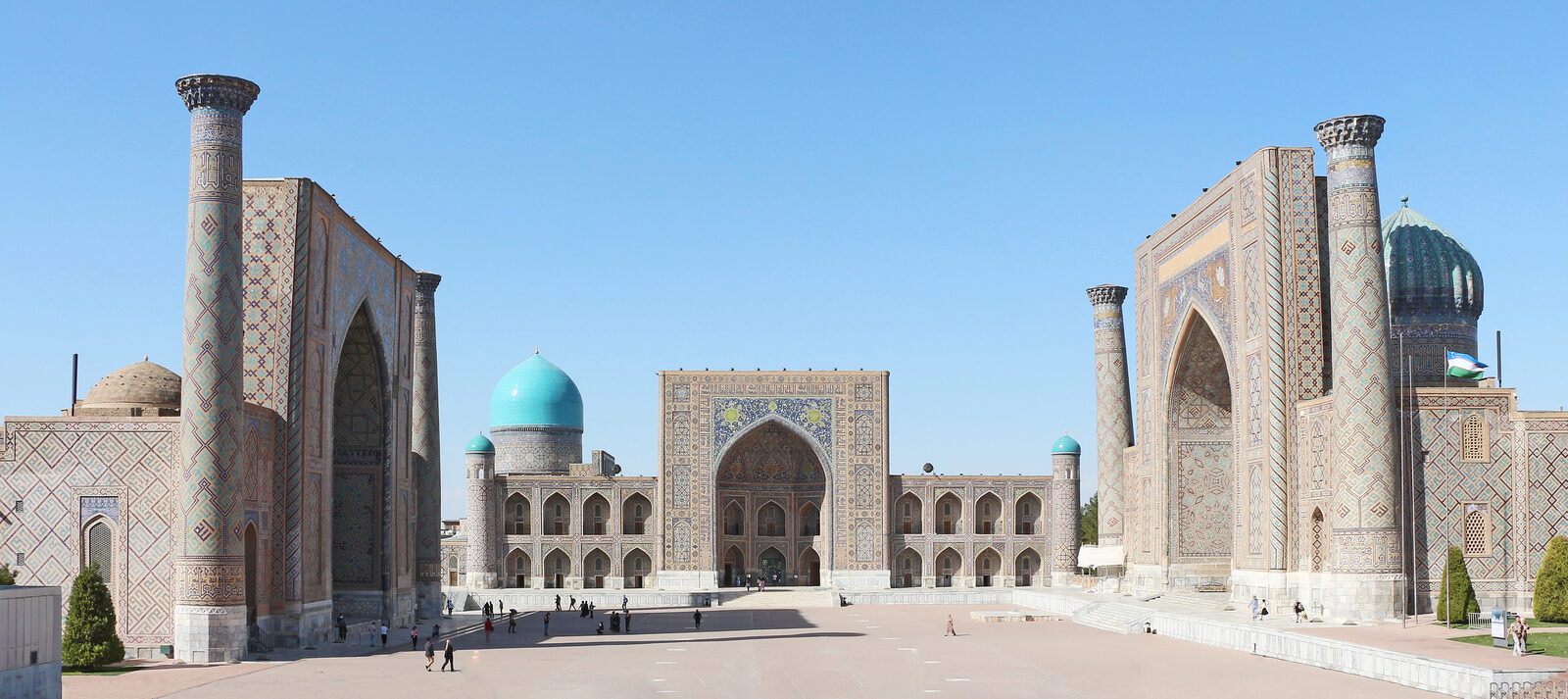 The three madrasas of the Registan in Samarkand under a clear blue sky in Uzbekistan