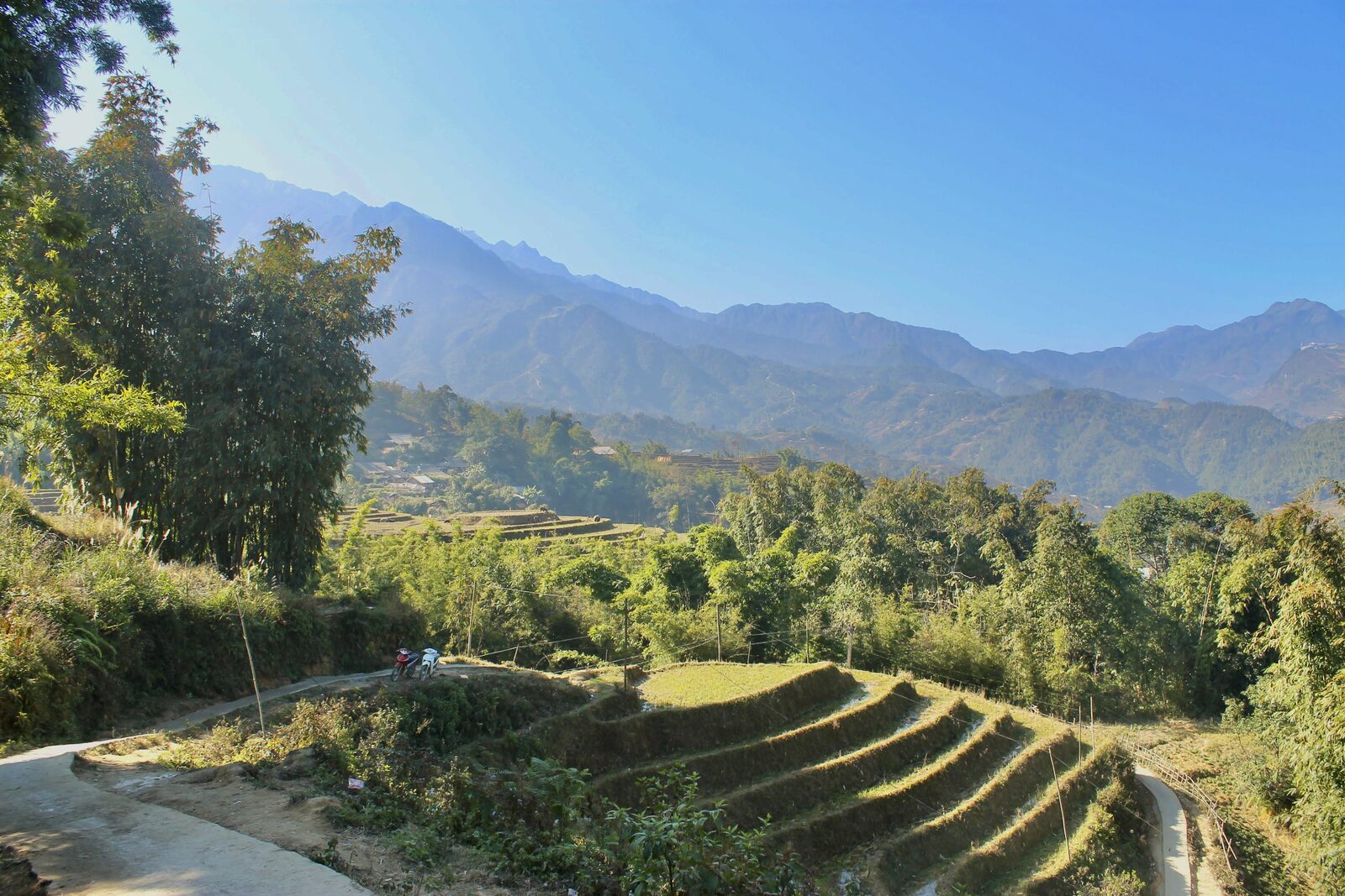 Green mountain rice terraces under blue sky near Sapa in the highlands of northern Vietnam
