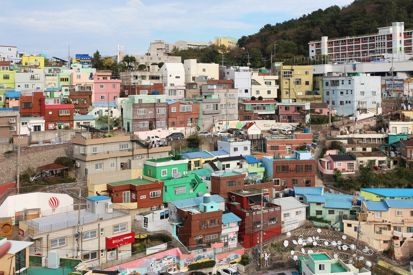 Brightly painted houses stacked on a hillside at Gamcheon Culture Village in Busan