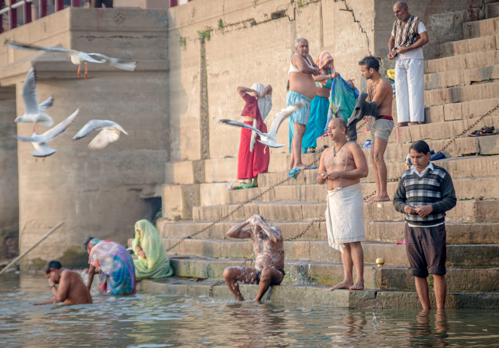 Pilgrims bathing at the ghats on the Ganges in Varanasi, India