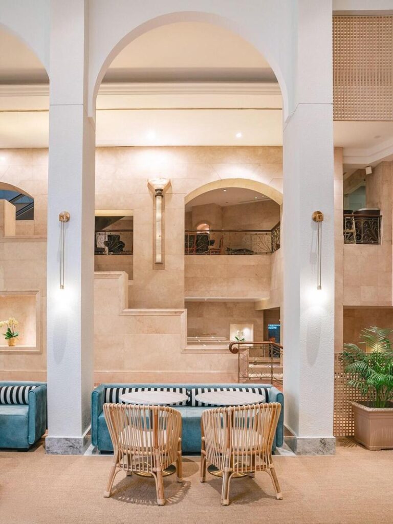 Cafe seating beneath arches at Furama RiverFront Singapore