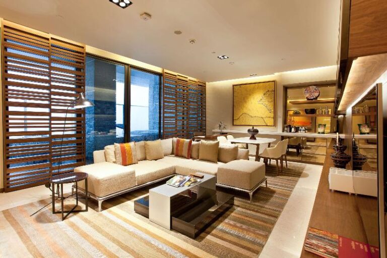 Suite living area with sofa and dining table at One Farrer Hotel Singapore
