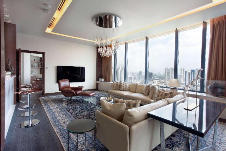 Corner suite living room overlooking the city at One Farrer Hotel Singapore