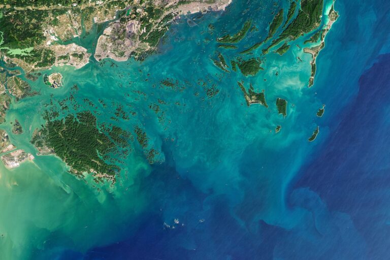 Limestone karsts rising from the water at Bai Tu Long Bay, Vietnam