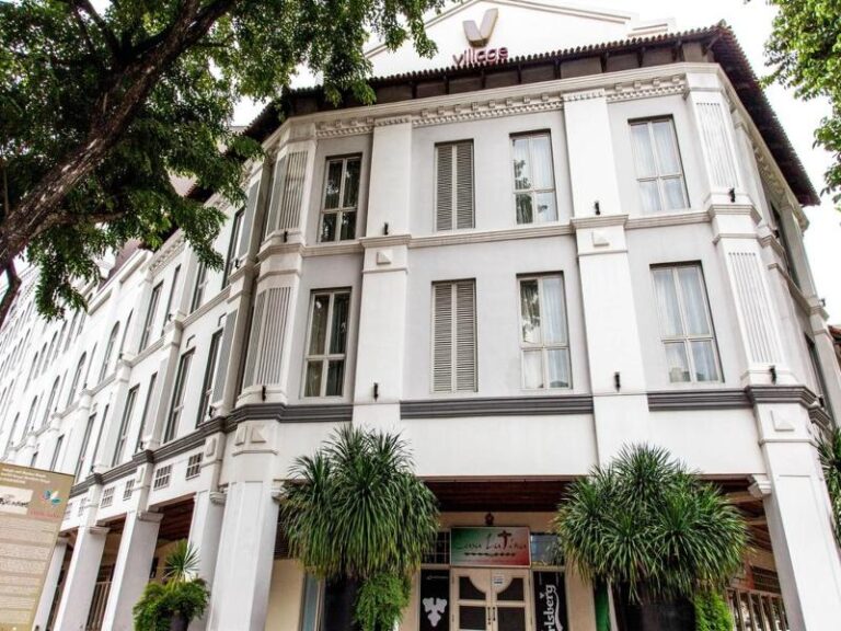Restored white shophouse frontage of Village Hotel Albert Court Singapore