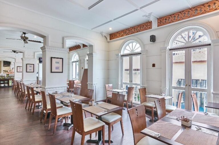 Hotel restaurant with arched windows at Village Hotel Albert Court Singapore