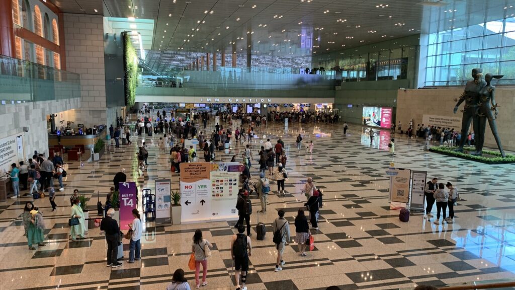 Arriving passengers in the Terminal 3 hall at Singapore Changi Airport