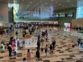 Arriving passengers in the Terminal 3 hall at Singapore Changi Airport